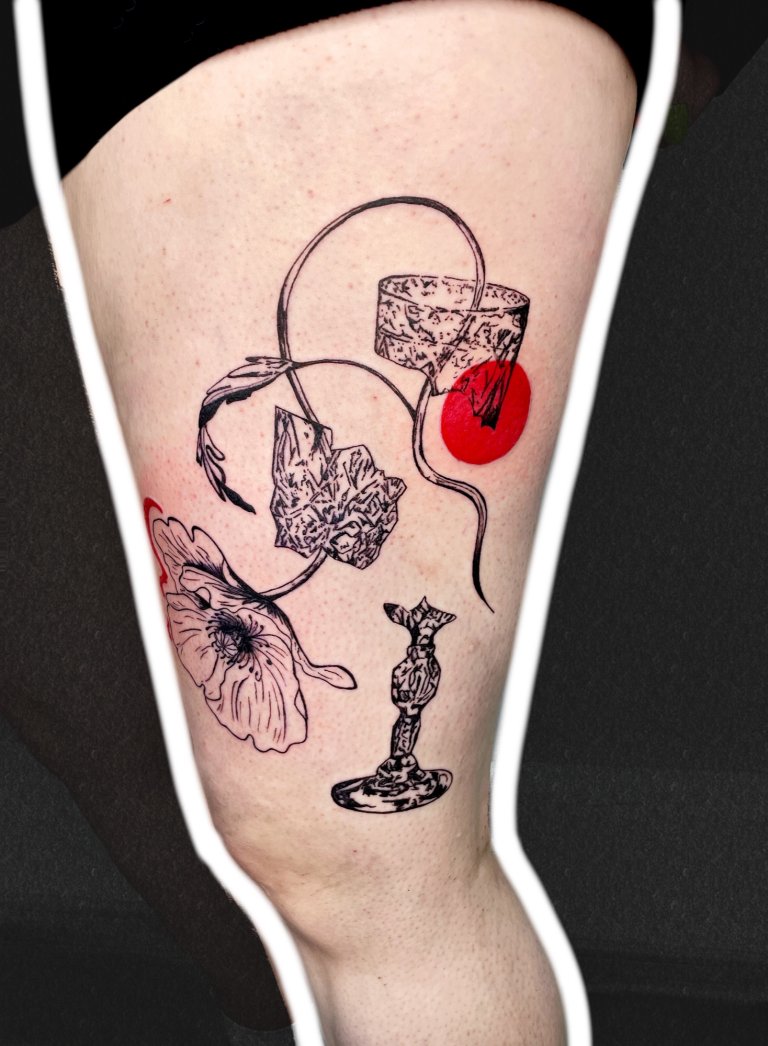Poppy in a broken glass, thigh tattoo