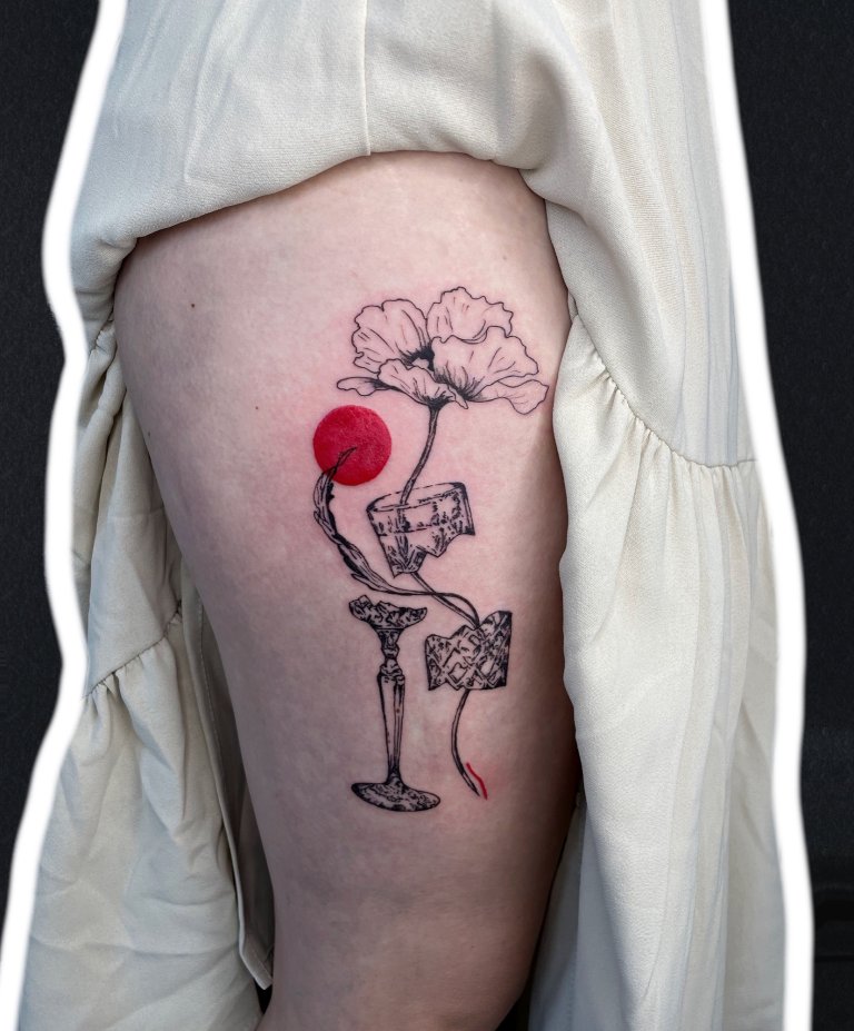 Poppy in a wine glass, back of the thigh tattoo