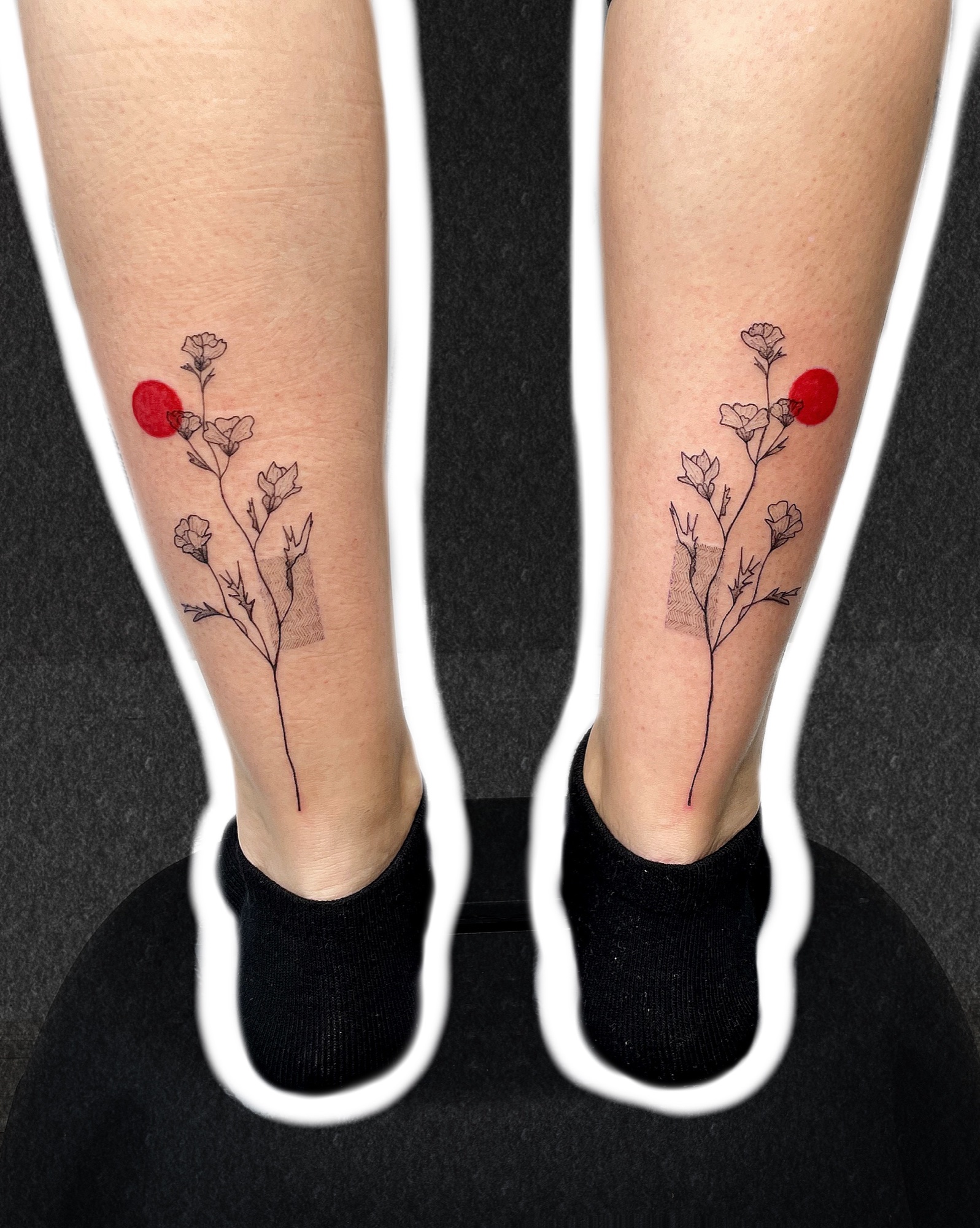 Matching poppies on both calves