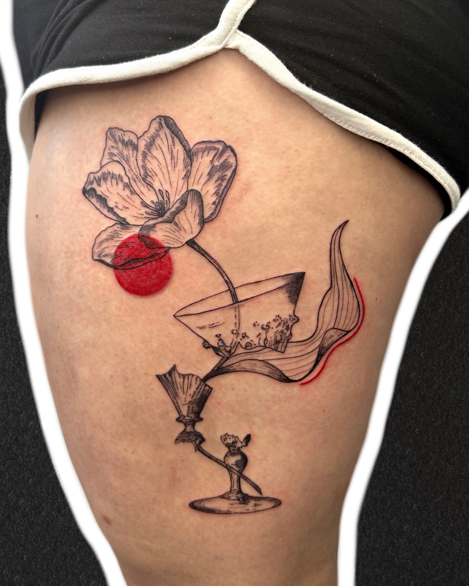 Tulip in a broken glass, thigh tattoo